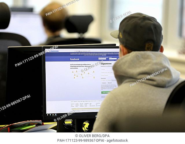 Employees working at their computers from the Competence Call Center, under management by Facebook, in Essen, Germany, 23 November 2017