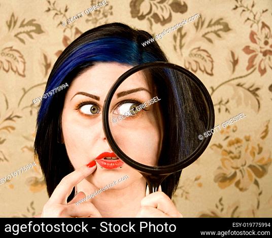 Pretty Woman with a Magnifying Glass