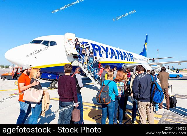 Trieste airport, Italy - 20 April 2018: People boarding Ryanair plane on Friuli Venezia Giulia Airport in Trieste, italy on April 20th, 2018