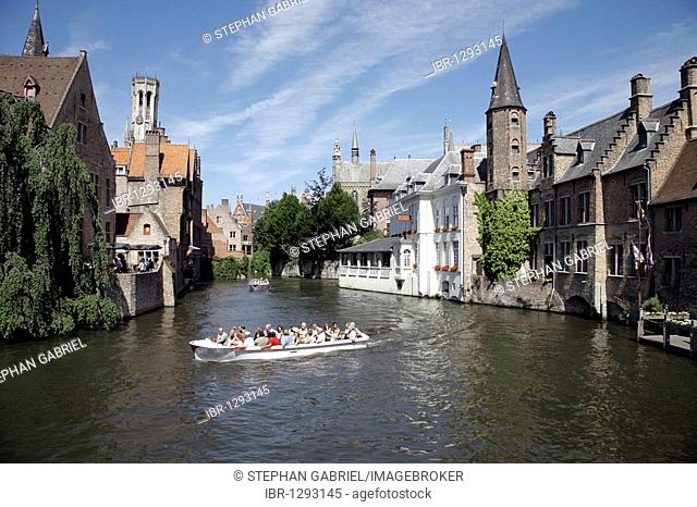 Boat tour through canals, historic center of Bruges, Flanders, Belgium, Europe