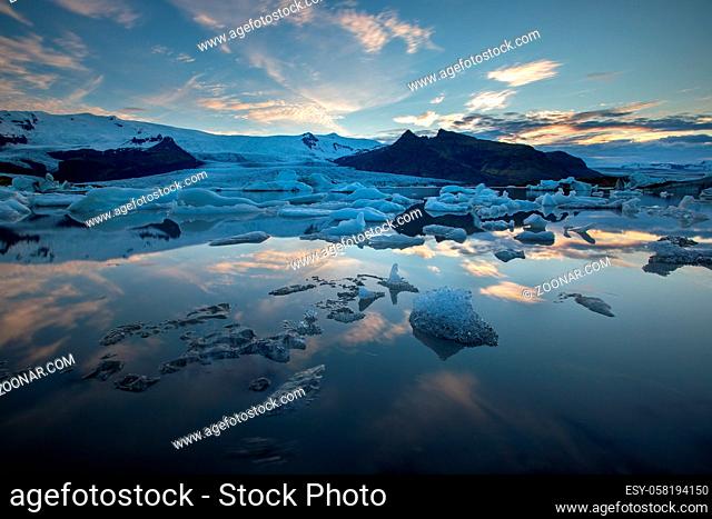 Arctic nature scenery of Jokulsarlon, glacier lagoon in Iceland at night with ice melting and floating in water