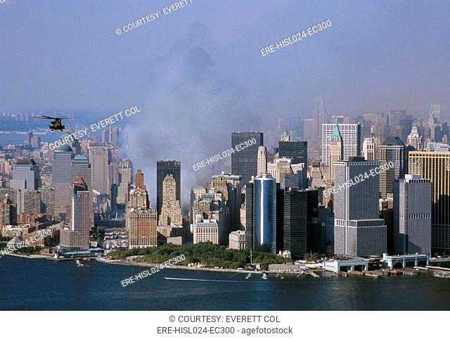 Smoke from the ruins of the World Trade Center two days after the 9/11 terrorists attacks north of New York City's Battery Part and Financial District office...