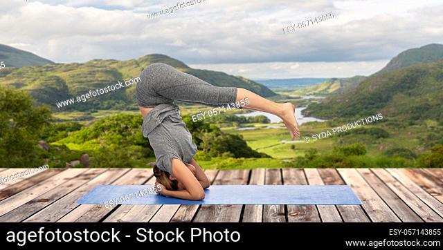 woman doing yoga over Killarney National Park