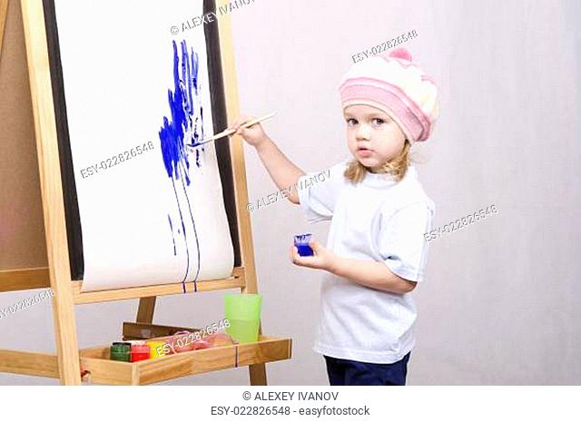 Girl artist paints on canvas