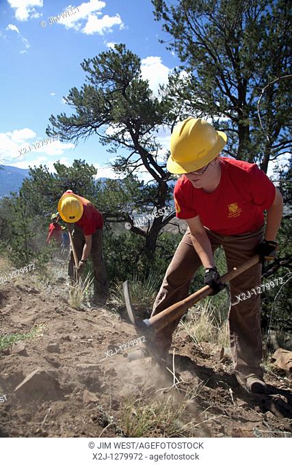 Salida, Colorado - A crew from the Southwest Conservation Corps builds a mountain bike trail on land administered by the U S  Bureau of Land Management  Modeled...