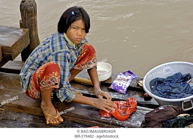 Child washing clothes, Myanmar, Burma