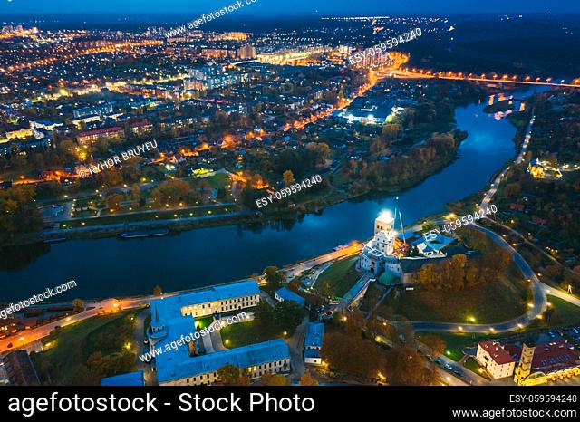 Grodno, Belarus. Night Aerial View Of Hrodna Cityscape Skyline. Popular Famous Historic Landmarks In Lightning. Old And New Castles