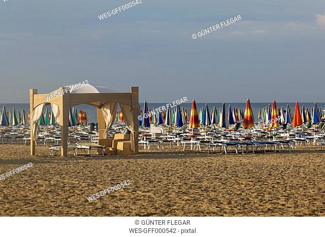 Italy, Friuli-Venezia Giulia, Province of Udine, Lignano Sabbiadoro, Beach with sun loungers in the evening