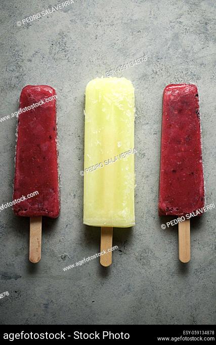 Popsicles on a stone table