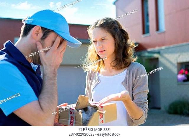 Young attractive woman angry against delivery man