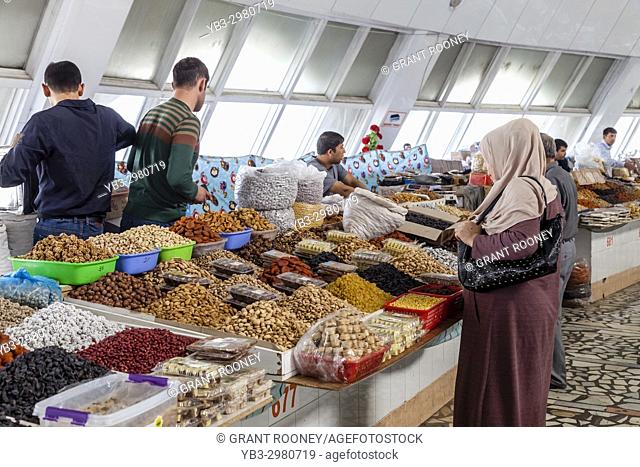 Local People Buying Dried Fruit and Nights At The Chorsu Bazaar, Tashkent, Uzbekistan