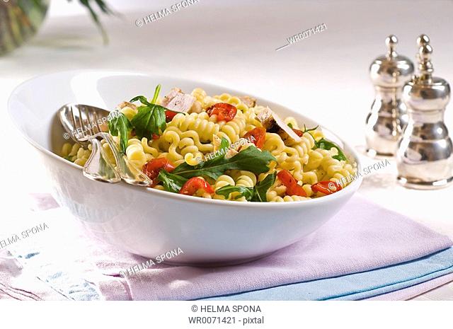 Pasta salad with rocket salad and tomatoes