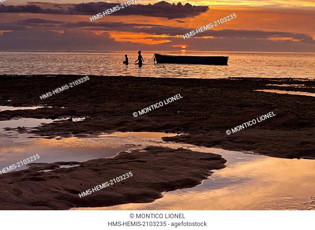 Mauritius, South West Coast, Black River District, boy playing on a boat