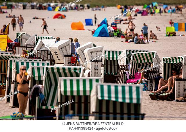 Tourists enjoying the warm sunny weather for a visit to the beach in Boltenhagen, Germany, 20 June 2016. On the Baltic sea beach