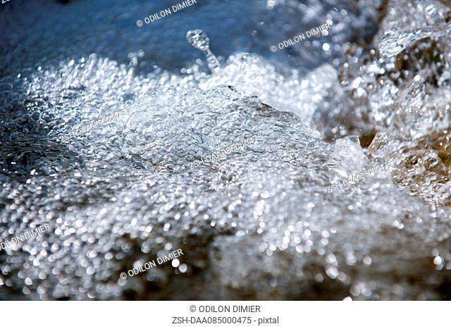 Bubbles on surface of flowing water