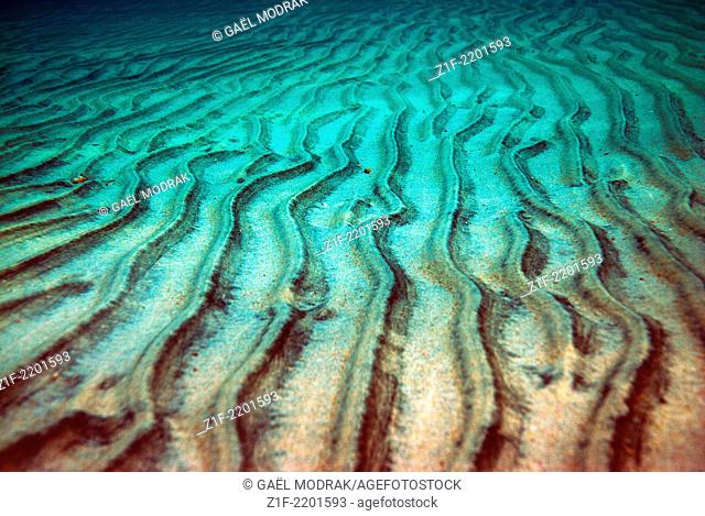 The sand stripes under the water surface in Corsica
