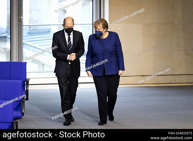 (LR) Olaf Scholz, Executive Minister of Finance, and Angela Merkel, Executive Chancellor, recorded during the session of the German Bundestag in Berlin