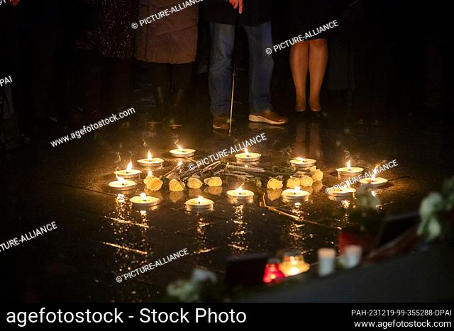 19 December 2023, Berlin: Candles form a heart at a memorial for the victims of the Islamist terrorist attack on Breitscheidplatz