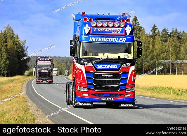 Colourful Scania R500 semi truck of T. Oscarssons Škeri Ab, Sweden, in truck convoy to Power Truck Show 2021. Urjala, Finland. August 12, 2021