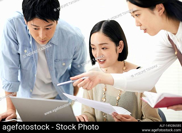 Japanese businesspeople working in the office