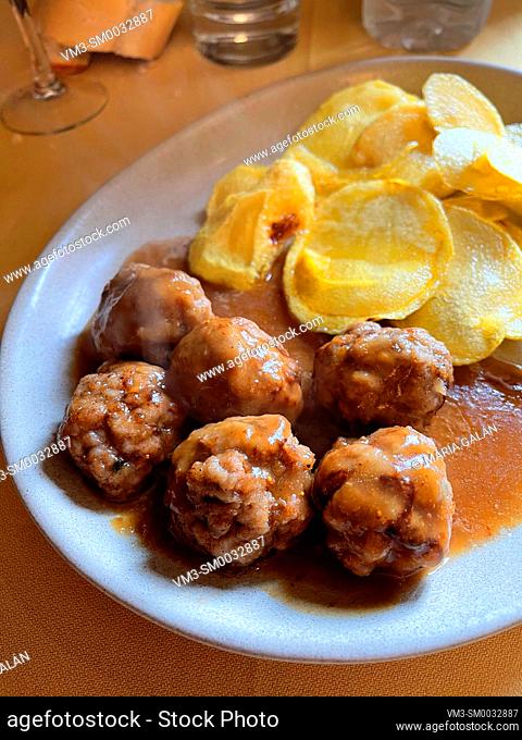 Meatballs with fried potatoes. Spain