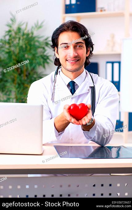 Young doctor cardiologist working in the clinic
