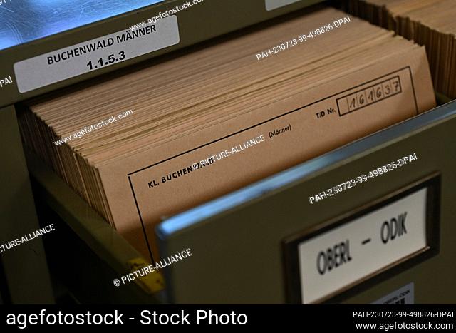 PRODUCTION - 11 July 2023, Hesse, Bad Arolsen: Sorted ""prisoner personnel cards"" lie in a cabinet in the archive room of the Arolsen Archives