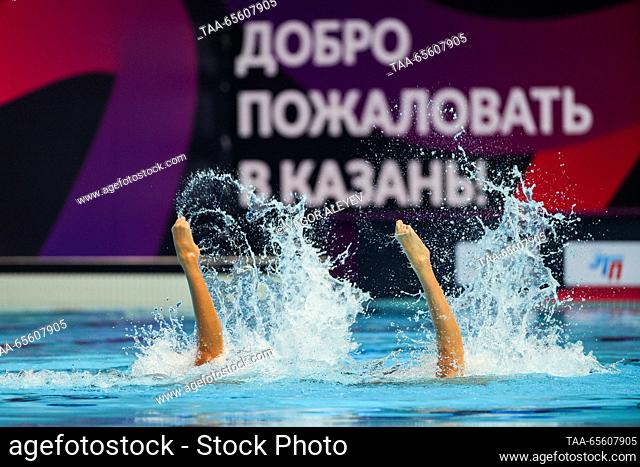 RUSSIA, KAZAN - DECEMBER 10, 2023: Swimmers Ziedakhon Toshkhuzhaeva and Diana Onkes of Uzbekistan perform their duet technical routine during the Synchronised...
