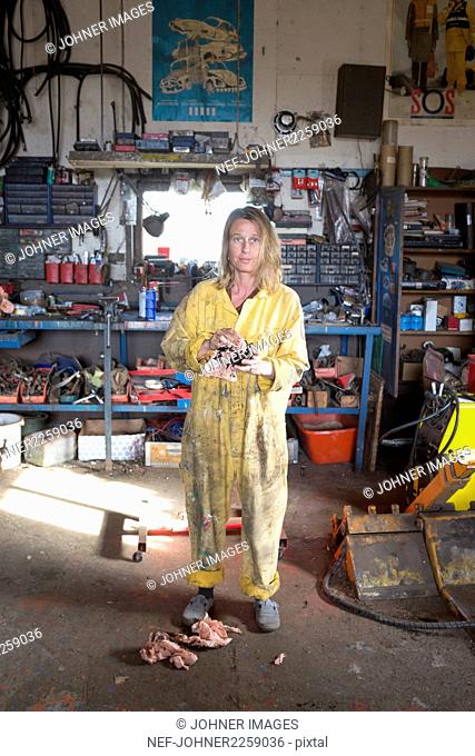 Woman mechanic in workshop