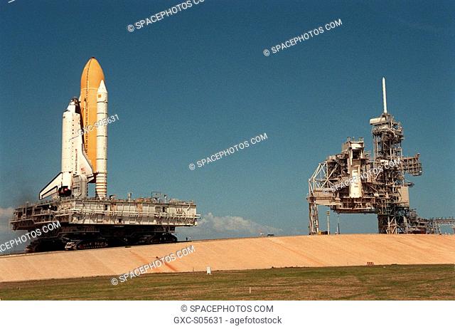 03/25/2000 -- The Space Shuttle Atlantis, atop the mobile launcher platform and crawler-transporter, begins the climb up the ramp to Launch Pad 39A