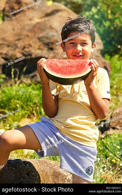 Child 5-10 years eating watermelon, Zumaia, Gipuzkoa, Basque Country, Spain