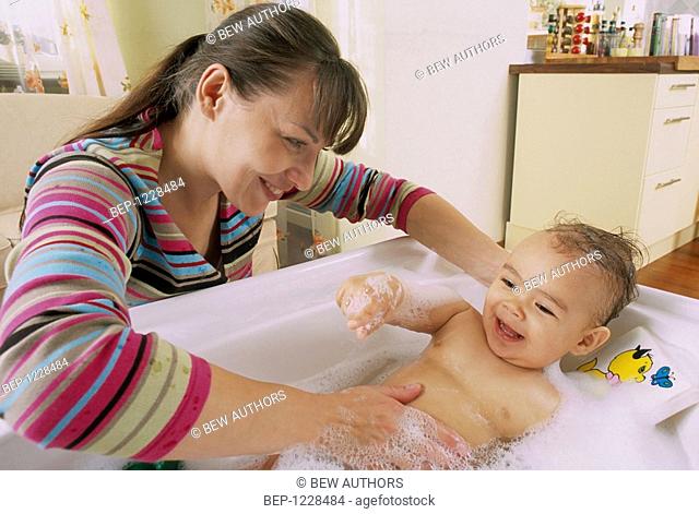 Woman washing child
