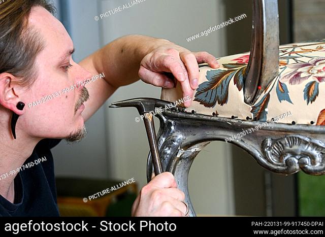 31 January 2022, Brandenburg, Potsdam: Restorer Maximilian Busch works in the workshops of the Prussian Palaces and Gardens Foundation Berlin-Brandenburg on an...