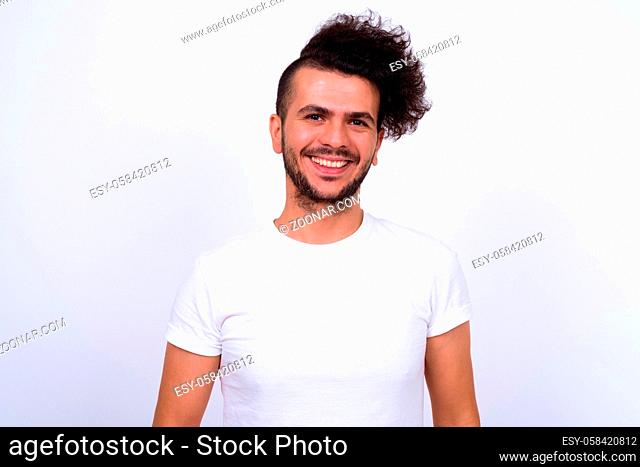 Studio shot of handsome Turkish man against white background