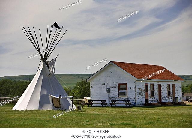 Teepee and building at the Wood Mountain Post Provincial Historic Park, Saskatchewan, Canada