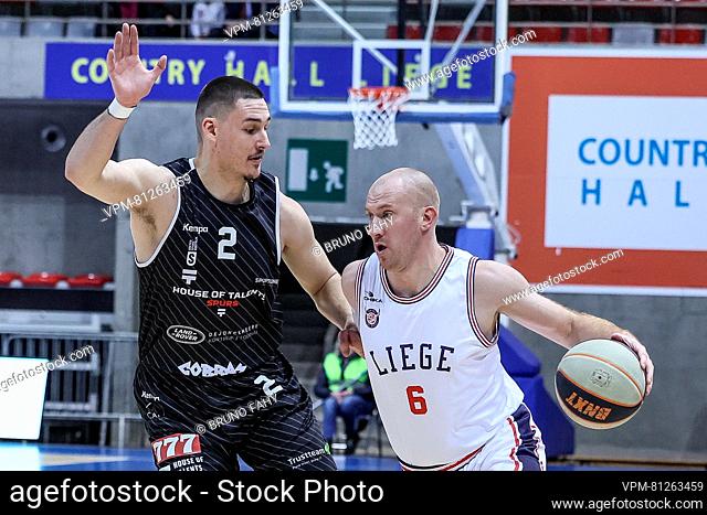 Kortrijk's Yarick Brussen and Liege's Brieuc Lemaire fight for the ball during a basketball match between RSW Liege Basket and House of Talents Spurs Kortrijk