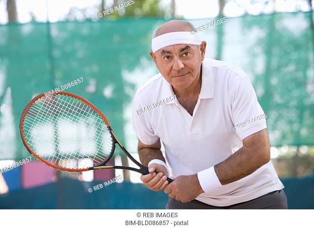 Chilean man playing tennis