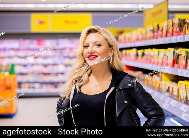 15 December 2020, North Rhine-Westphalia, Duesseldorf: Evelyn Burdecki, TV personality, stands in a Netto Marken-Discount store