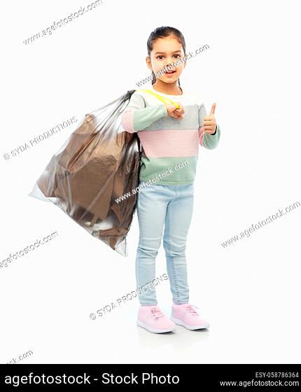 smiling girl with paper garbage in plastic bag