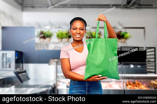 woman with reusable bag for food shopping