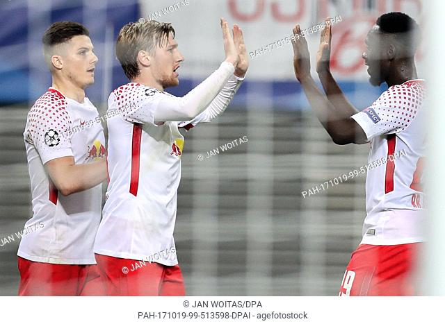 Leipzig's Marcel Sabitzer (L-R), Emil Forsberg and Jean-Kevin Augustin cheer after a score during the Champions League group stages qualification match between...