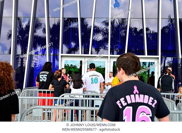 Fans place flowers at a memorial at Marlins Park in Miami, Florida, for Marlins pitcher Jose Fernandez (#16), who died in a boating accident