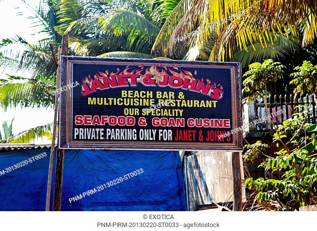 Sign board of a restaurant, Janet and John's, Goenkar Vaddo, Mid Anjuna Beach, Anjuna, Bardez, North Goa, Goa, India