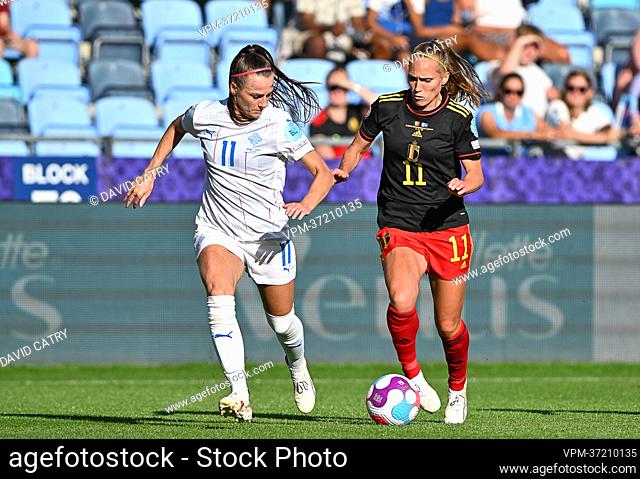 Iceland's Hallbera Gisladottir and Belgium's Janice Cayman fight for the ball during a game between Belgium's national women's soccer team the Red Flames and...