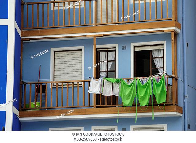 laundry drying on a balcony, Plaza Comercio, Cudillero, Asturias, Spain