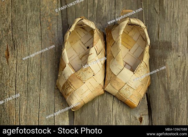 Birch bark shoes, door decoration, log door background