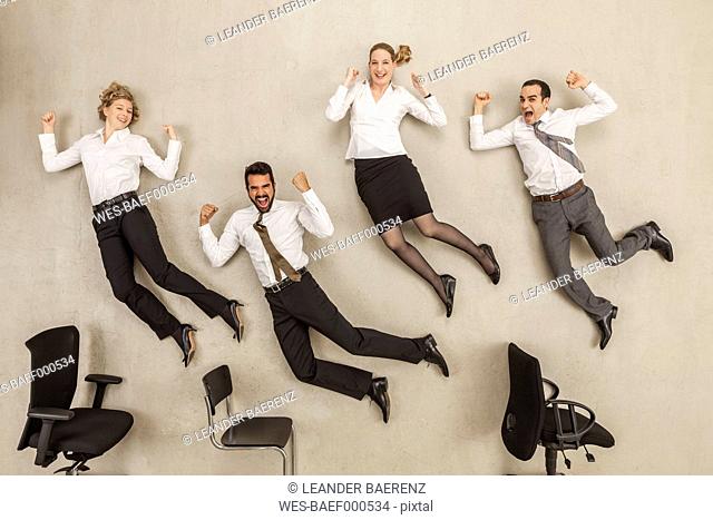 Business people jumping in office