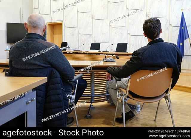 07 December 2023, Baden-Württemberg, Mannheim: The two defendants are sitting in the courtroom of the district court. They are alleged to have beaten horses...