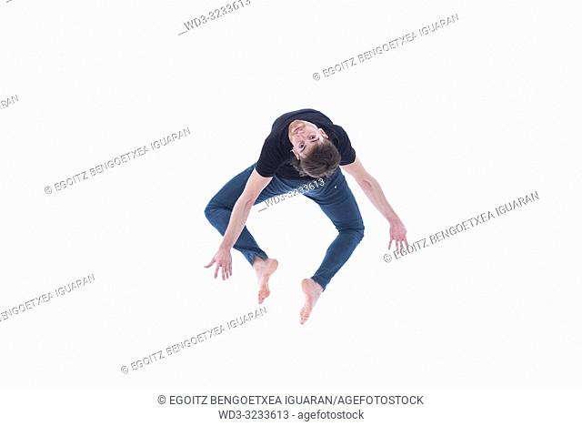 Casual dressed contemporary dancer on white background
