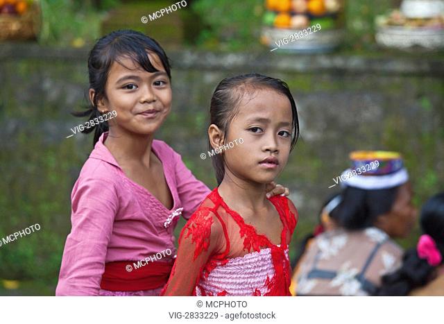 Young BALINESE girls at PURA TIRTA EMPUL TEMPLE COMPLEX during the GALUNGAN FESTIVAL - TAMPAKSIRING, BALI, INDONESIA - 08/12/2010